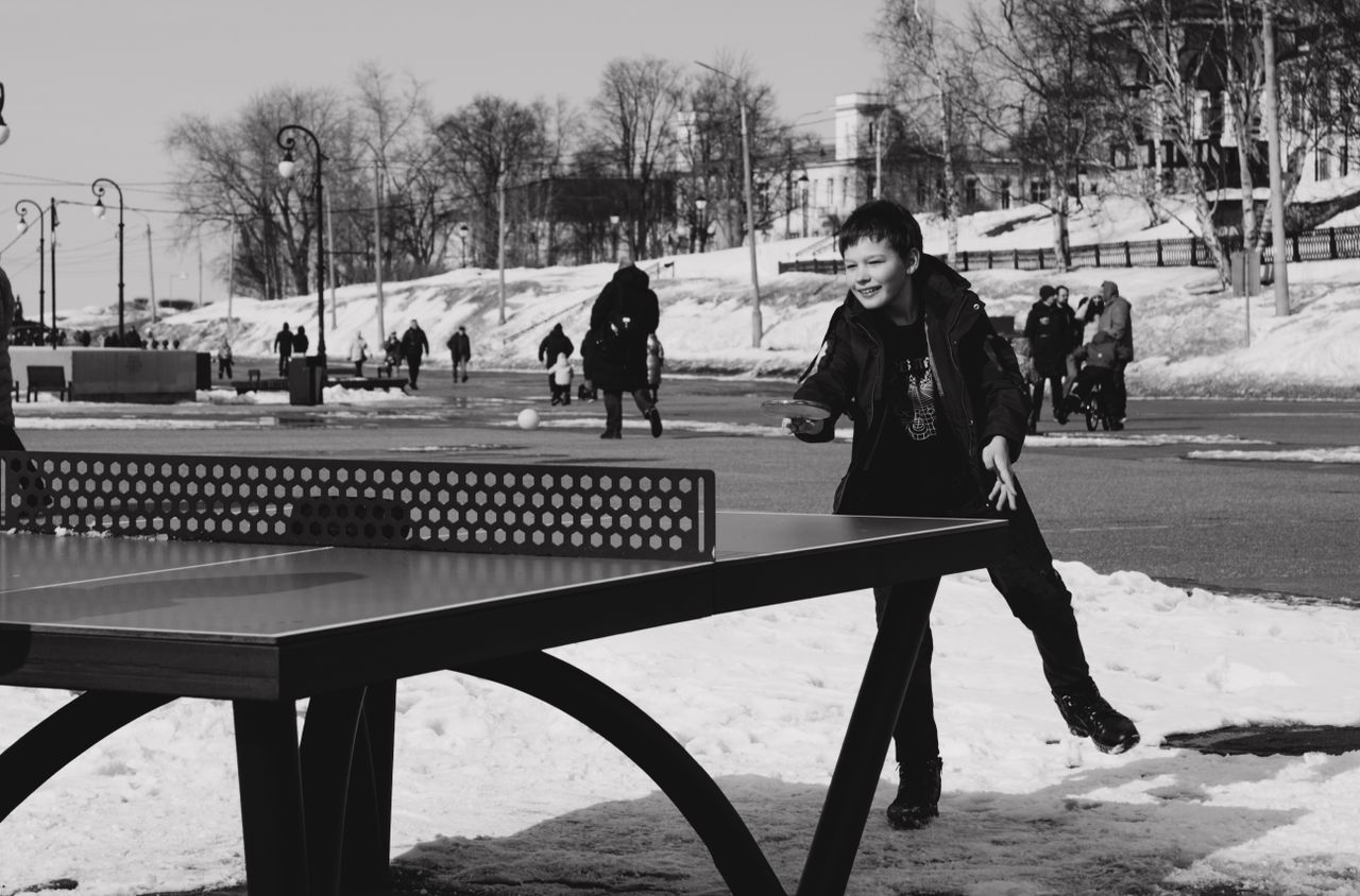 Crafting Captivating Headlines: Your awesome post title goes here A child enjoys a game of table tennis on a snowy day in Arkhangelsk, Russia.